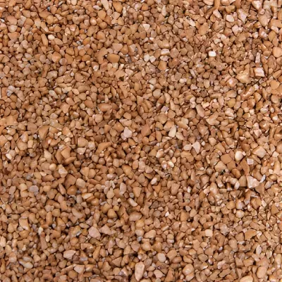 Pedras pequenas castanho claro e bege com textura áspera