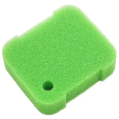 Esponja verde sintética com textura porosa e furo num canto