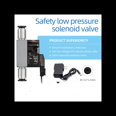 válvula solenóide de baixa pressão prateada e preta com texto explicativo e transformador preto