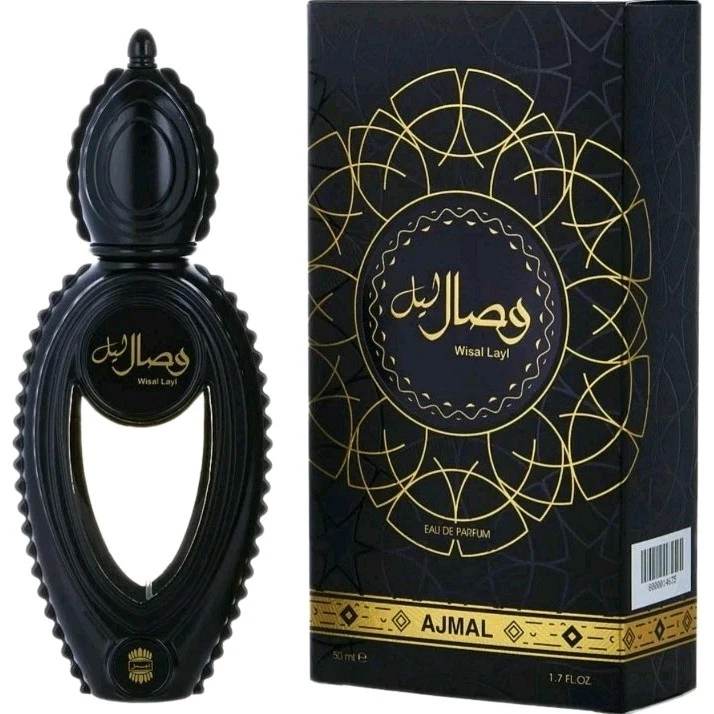 Frasco e caixa de perfume preto com detalhes dourados, design oval e texto Wisal Layl Ajmal