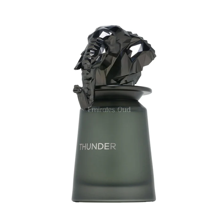 Frasco de perfume verde com tampa preta em forma de elefante