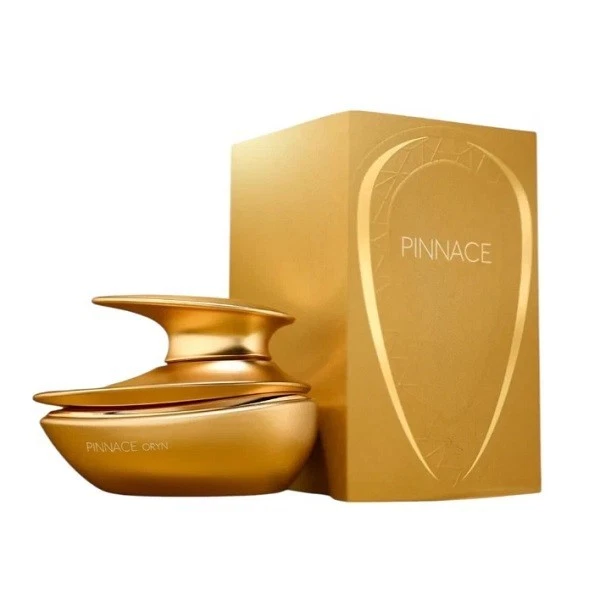 Frasco dourado de perfume com caixa dourada e texto PINNACE