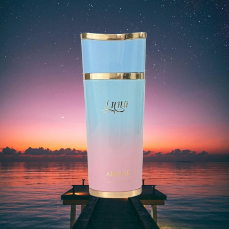 Frasco de perfume azul e rosa com detalhes dourados e texto Luna Armaf
