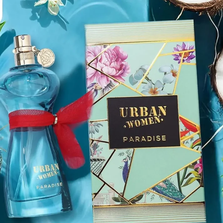 Frasco de perfume azul com caixa decorativa verde e flores