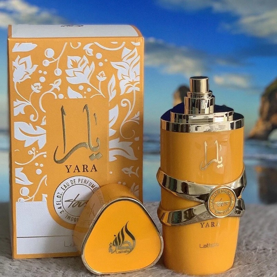 Perfume Yara amarelo com caixa decorativa ao ar livre
