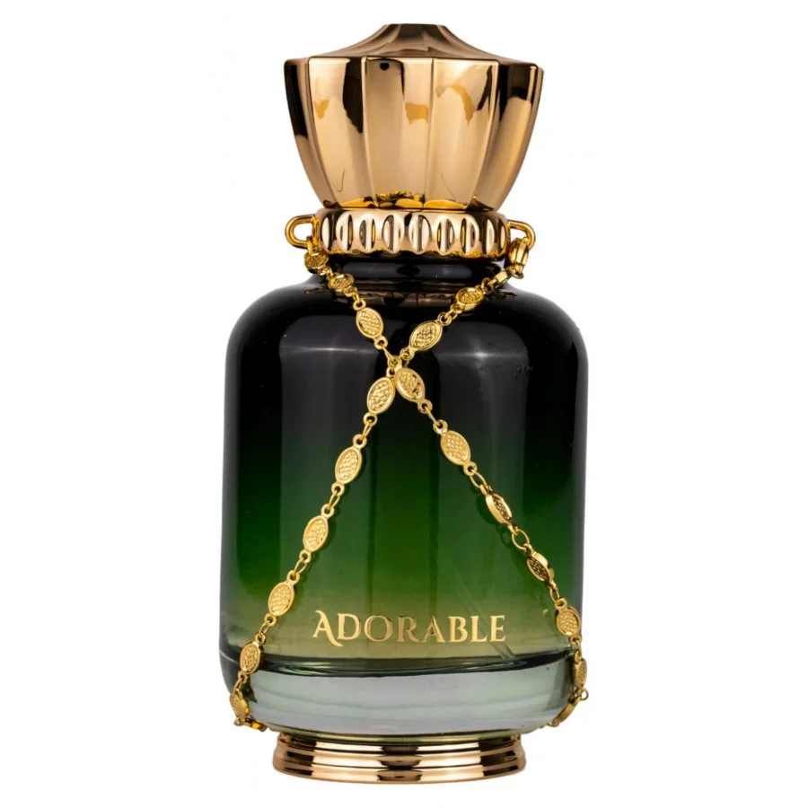 Frasco de perfume verde e preto com tampa dourada e corrente decorativa