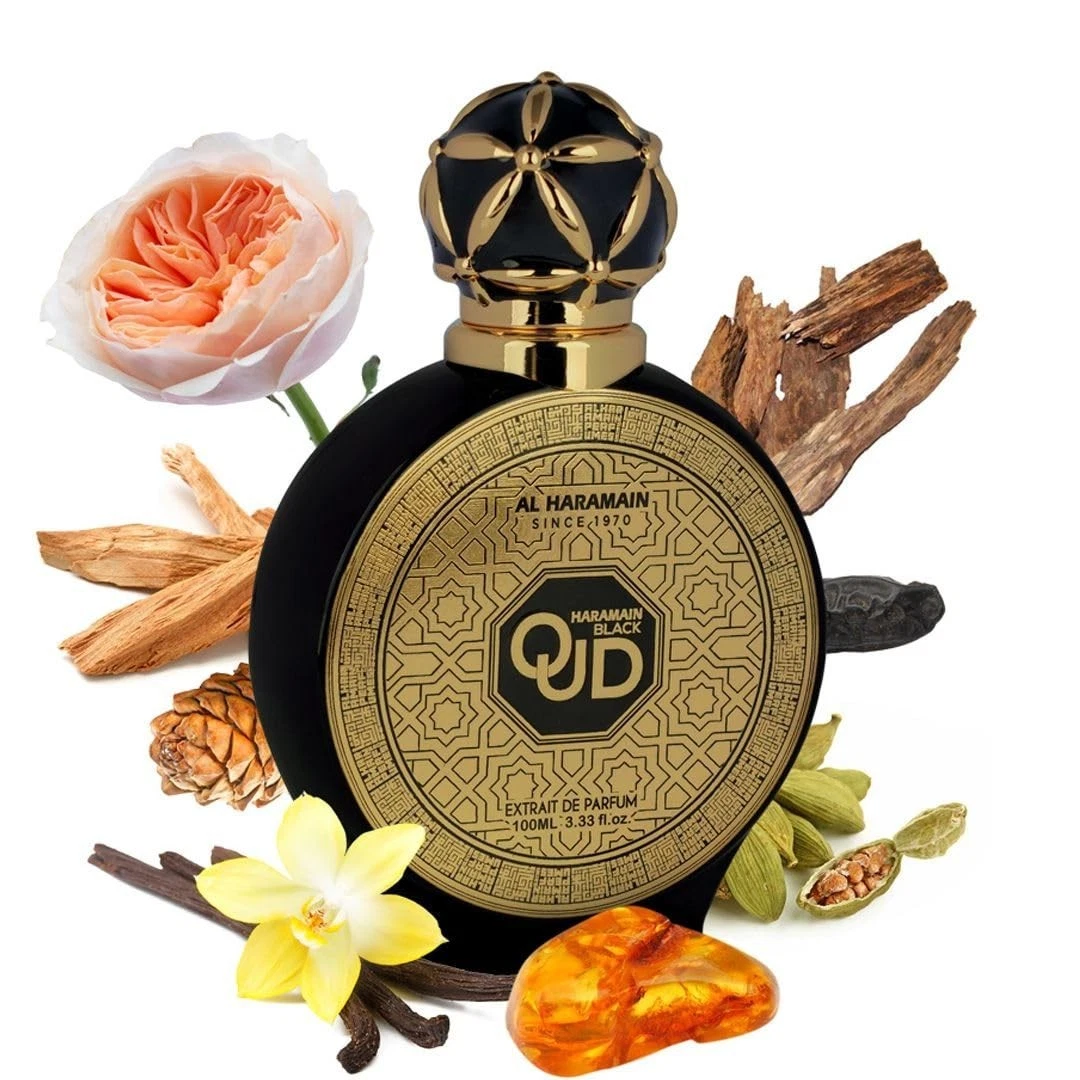 Frasco preto e dourado de perfume AL HARAMAIN com elementos naturais ao redor