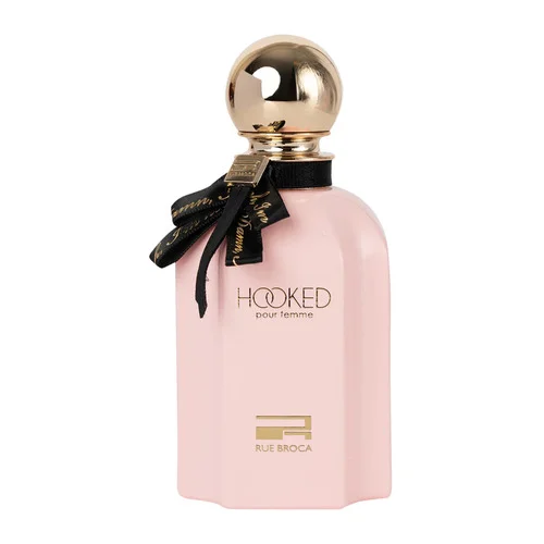 Frasco de perfume rosa claro com tampa dourada redonda e laço preto