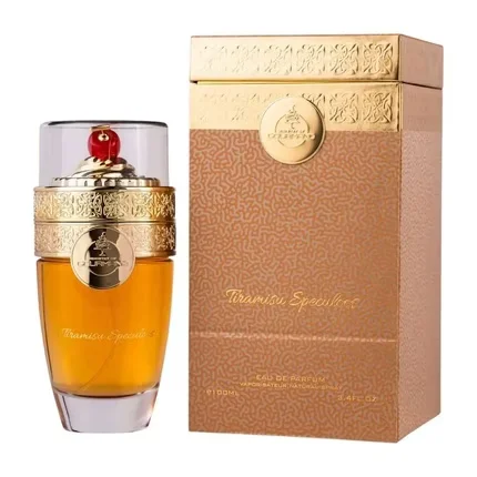 Frasco de perfume âmbar com tampa dourada e cereja, ao lado de caixa dourada e castanha Tiramisu Specularé