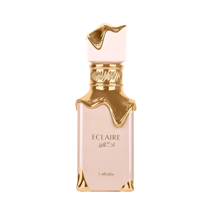 Frasco de perfume rosa claro e dourado com texto ECLAIRE e Lattafa