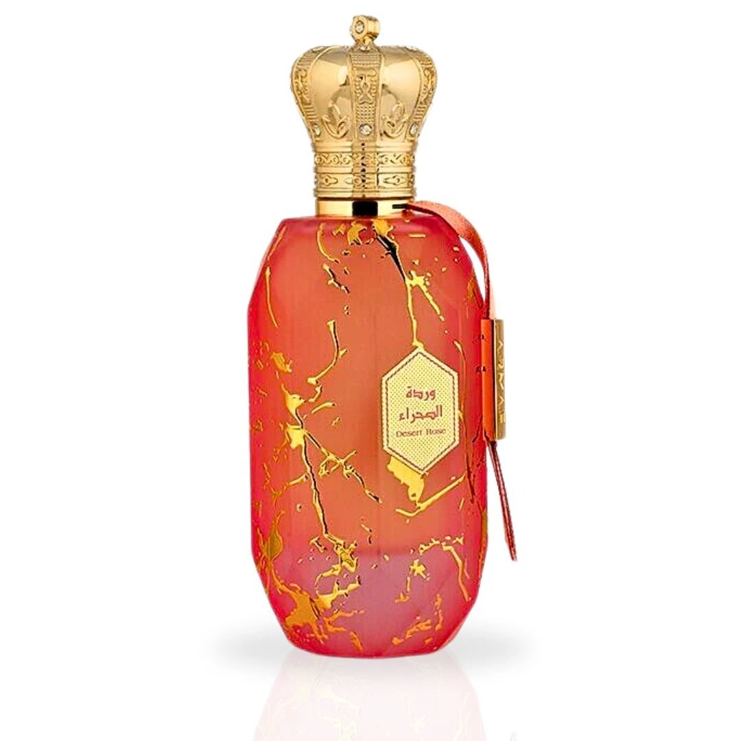 Frasco de perfume vermelho com tampa dourada em forma de coroa