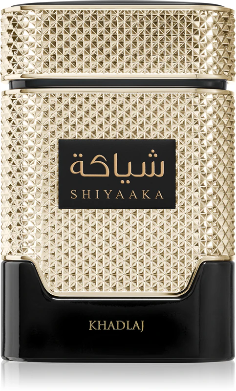 Frasco de perfume dourado e preto com texto em árabe e SHIYAAKA