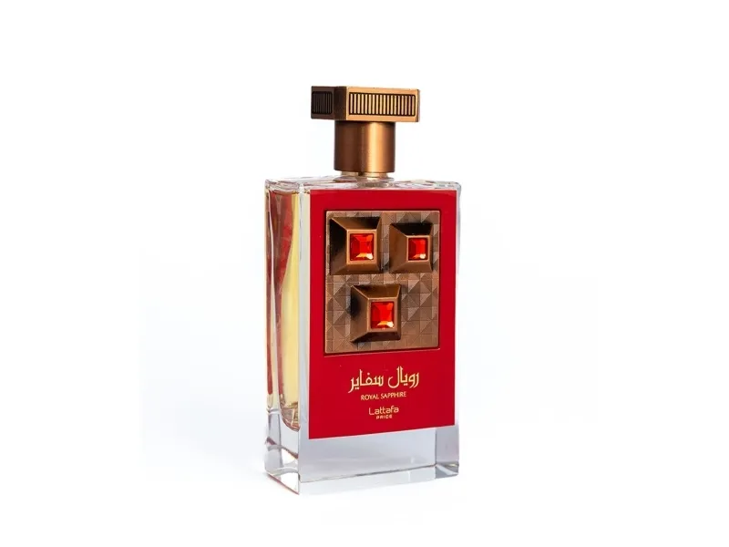 Frasco de perfume com rótulo vermelho e tampa dourada