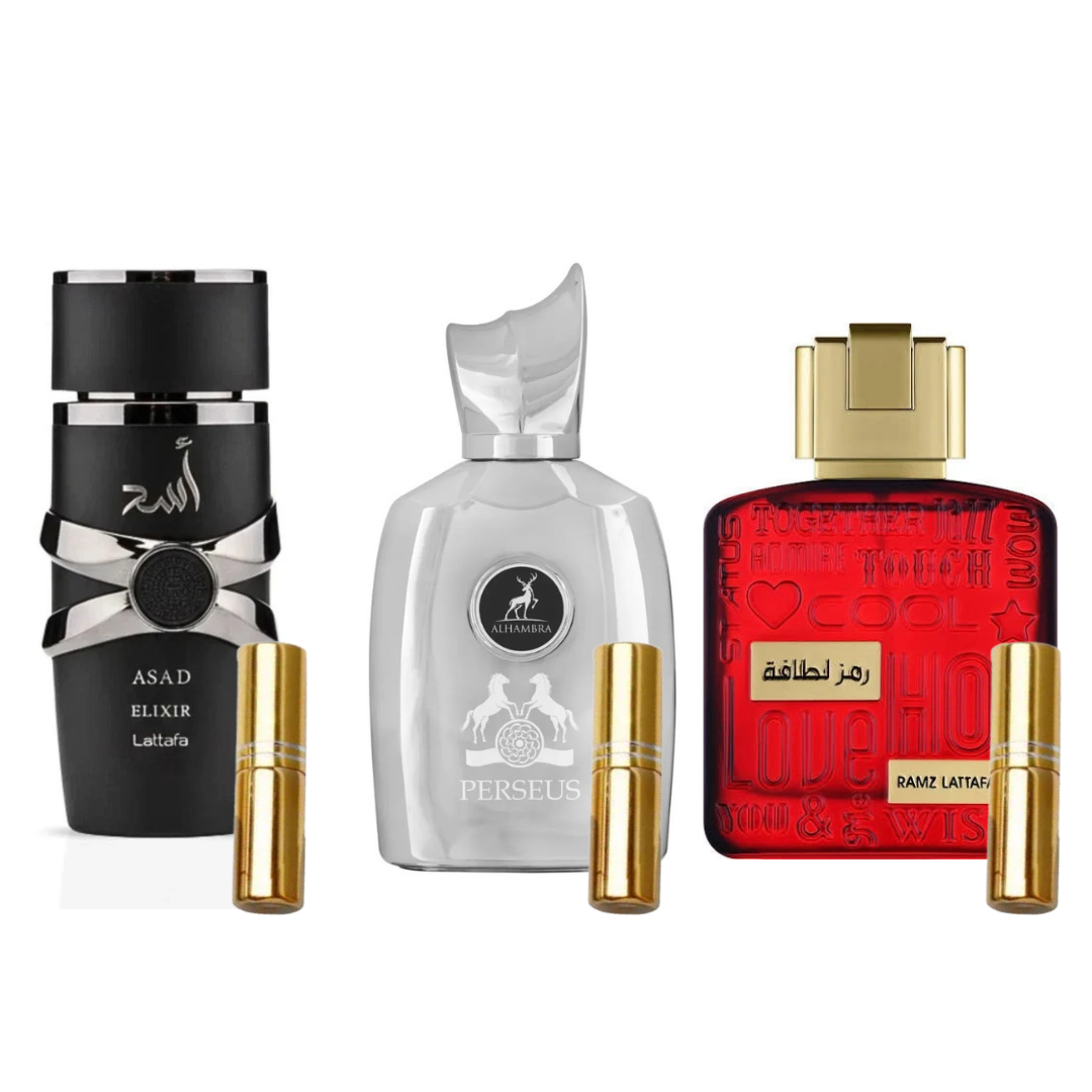 Três frascos de perfumes com embalagens preta, branca e vermelha, acompanhados por frascos pequenos dourados.