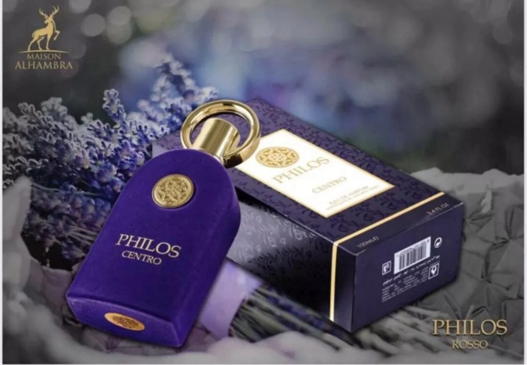 Frasco de perfume roxo com detalhes dourados junto a caixa preta e roxa com texto PHILOS