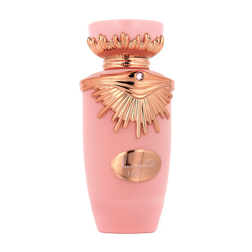 Frasco de perfume rosa com detalhes dourados brilhantes