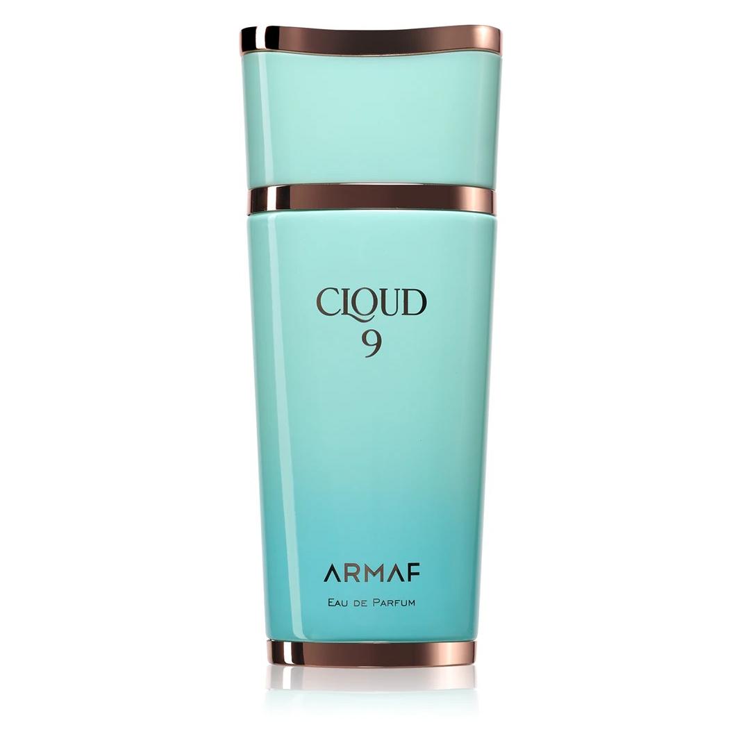 Frasco de perfume turquesa com detalhes cobre e texto preto