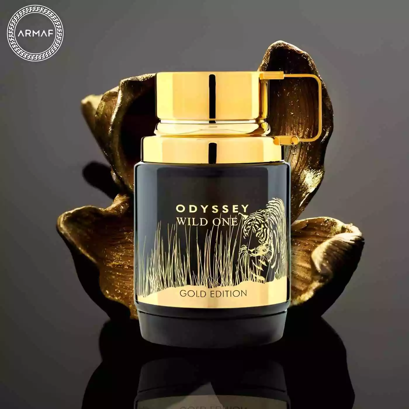 Frasco de perfume preto e dourado com ilustração de tigre, texto Odyssey Wild One Gold Edition