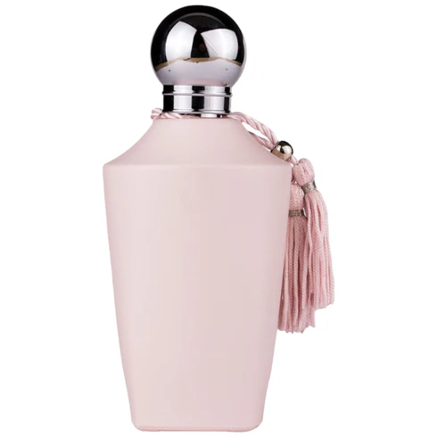 frasco de perfume rosa com tampa metálica e tassel rosa