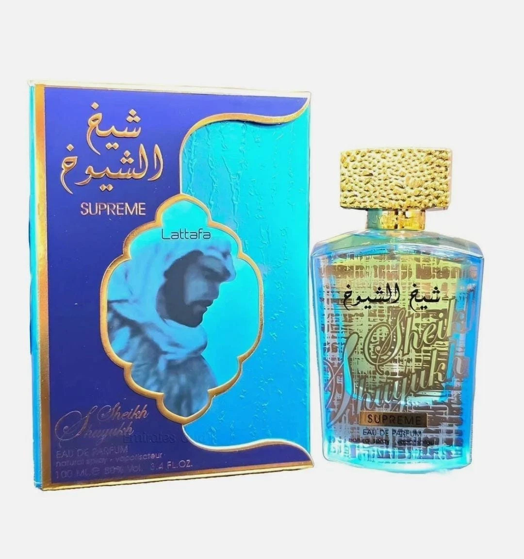 Frasco de perfume transparente com tampa dourada e caixa azul com imagem e texto em árabe