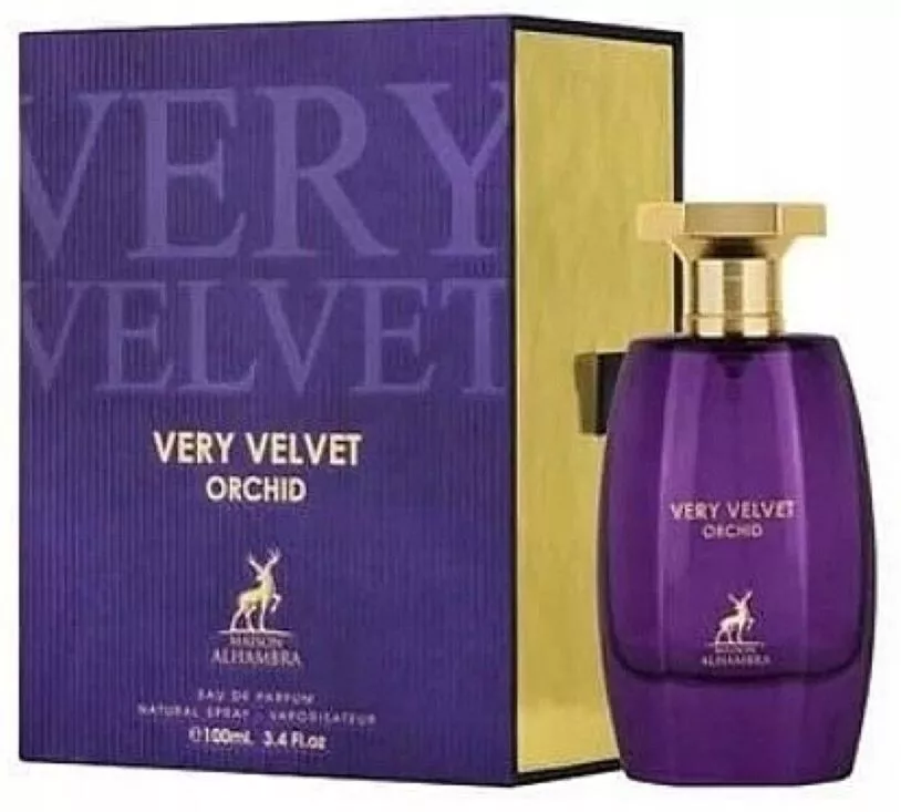 Perfume Very Velvet Orchid com frasco roxo e tampa dourada ao lado da caixa roxa com interior dourado