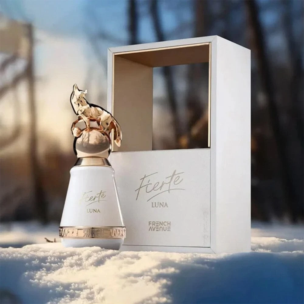Perfume Fierte Luna French Avenue com frasco branco e dourado em caixa branca na neve