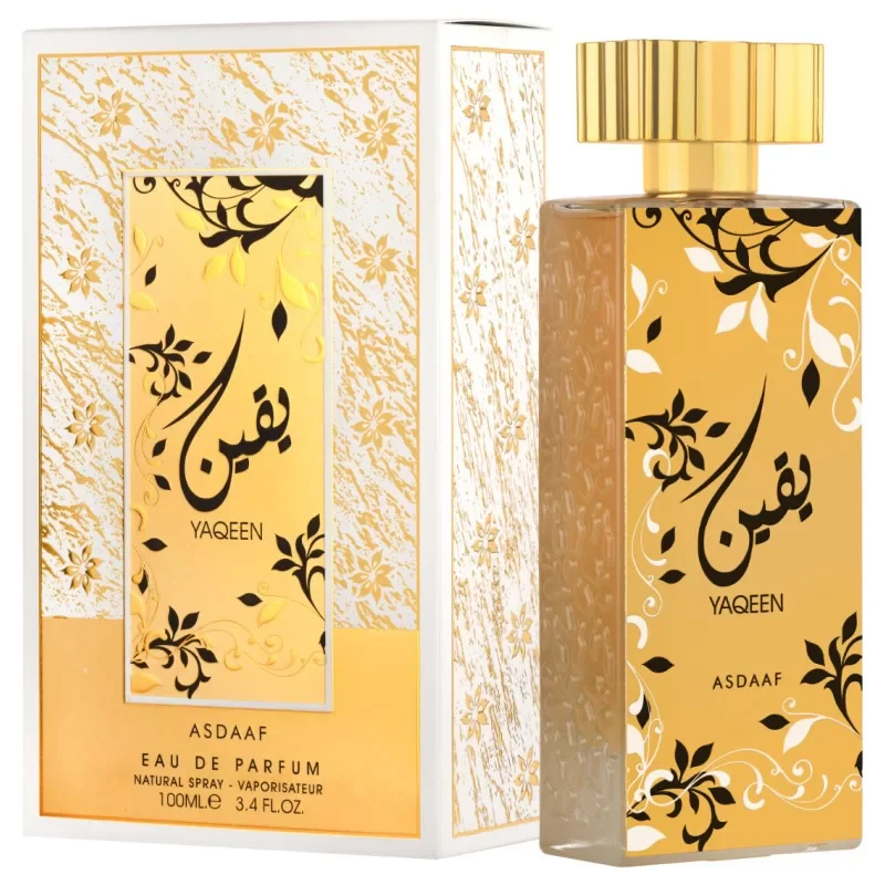 Frasco dourado de perfume e caixa com design floral preto e branco e texto YAQEEN ASDAAF.