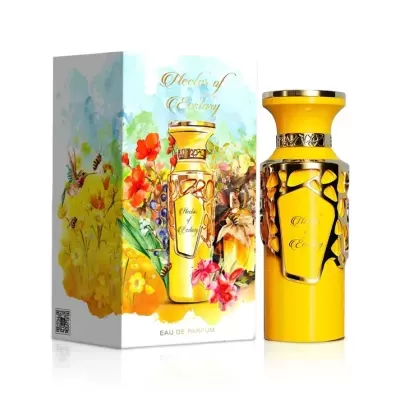 Frasco amarelo de perfume com embalagem colorida floral