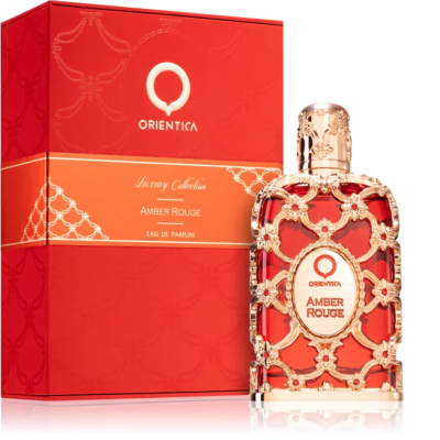 Frasco de perfume e caixa vermelha com detalhes dourados e texto 'Amber Rouge'
