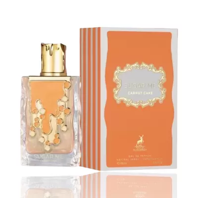 Frasco de perfume com tampa dourada e caixa laranja com texto Sugar Me Carrot Cake.