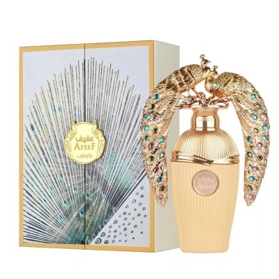 frasco de perfume dourado com pavões decorativos e caixa branca