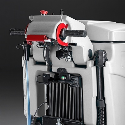 Máquina industrial cinzenta e vermelha com alças e cabos