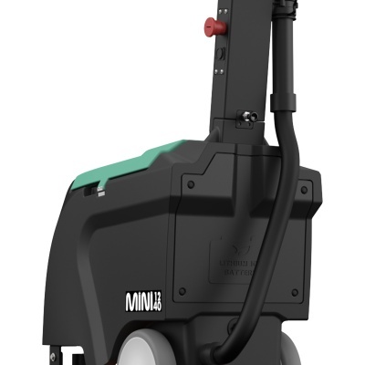 Parte de equipamento preto com detalhes verdes, roda cinza e inscrição MINI 12 40