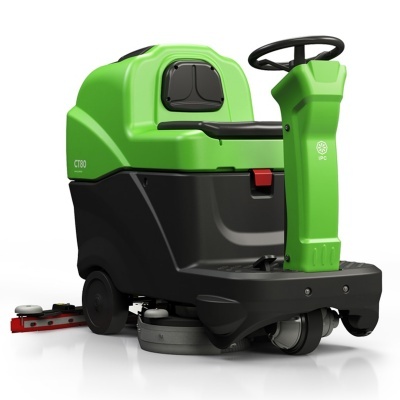 Máquina de limpeza industrial verde e preta com volante e assento