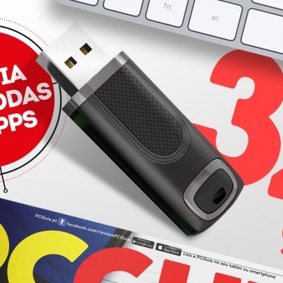 Pen USB preta, teclado branco, revista PC GUIA e destaque 32 gb em vermelho