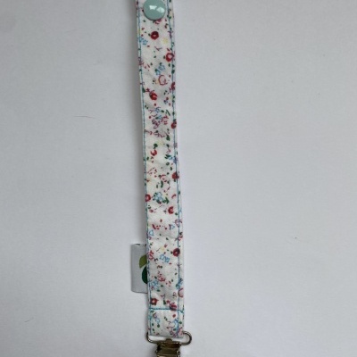 Fita com clip metálico e padrão floral colorido