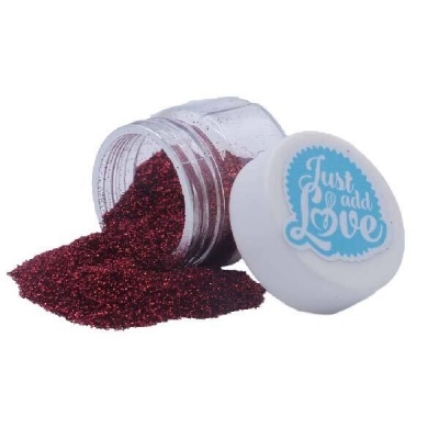 Pote de glitter vermelho com tampa branca etiquetada 'Just add Love'