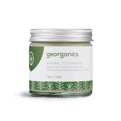 Pote de pasta de dentes mineral georganics com rótulo branco e verde