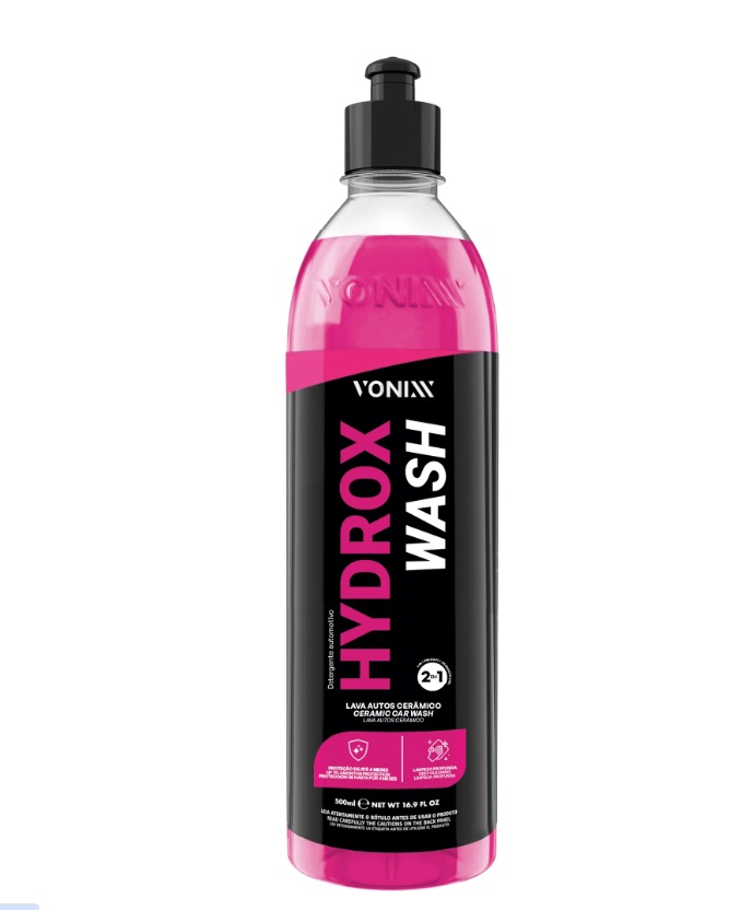 Frasco plástico com líquido rosa e rótulo preto com texto VONIXX HYDROX WASH