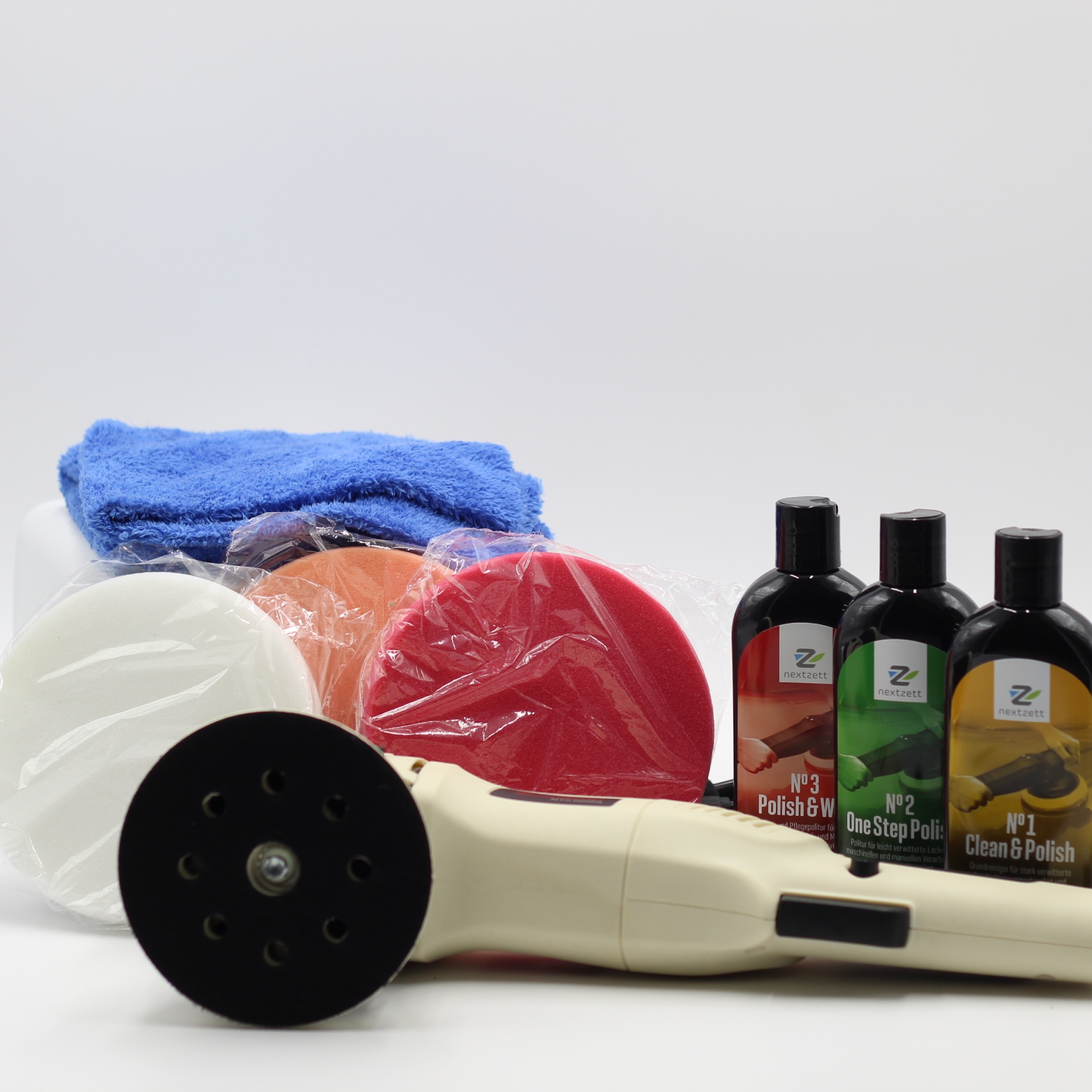 Kit de polimento automóvel com máquina elétrica, discos coloridos, três frascos de produtos e pano azul