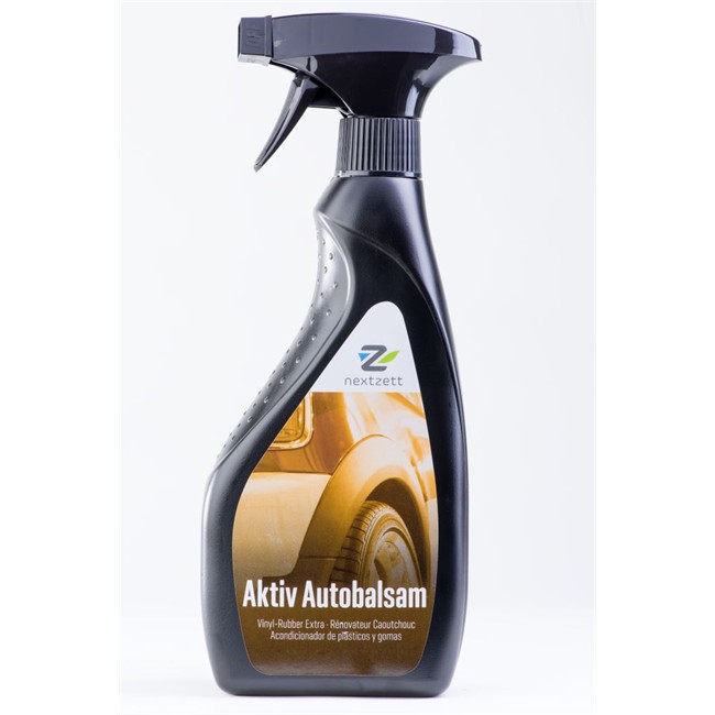 Frasco preto com pulverizador produto automóvel Aktiv Autobalsam nextzett com rótulo amarelo e texto em espanhol