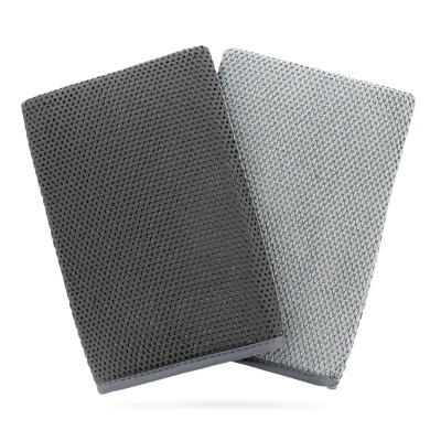 Blocos de notas cinza escuro e claro com capa texturizada e padrão de pontos