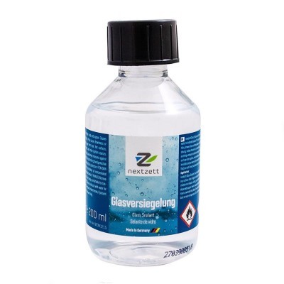 Frasco transparente com tampa preta e rótulo azul de selante para vidro