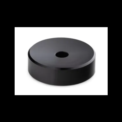 Base cilíndrica preta com orifício central sobre fundo branco