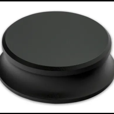 Suporte de telemóvel redondo preto sobre fundo branco.