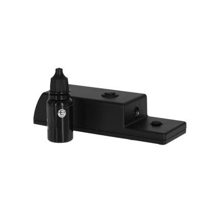 Suporte preto com botão e pequeno frasco preto com selo branco