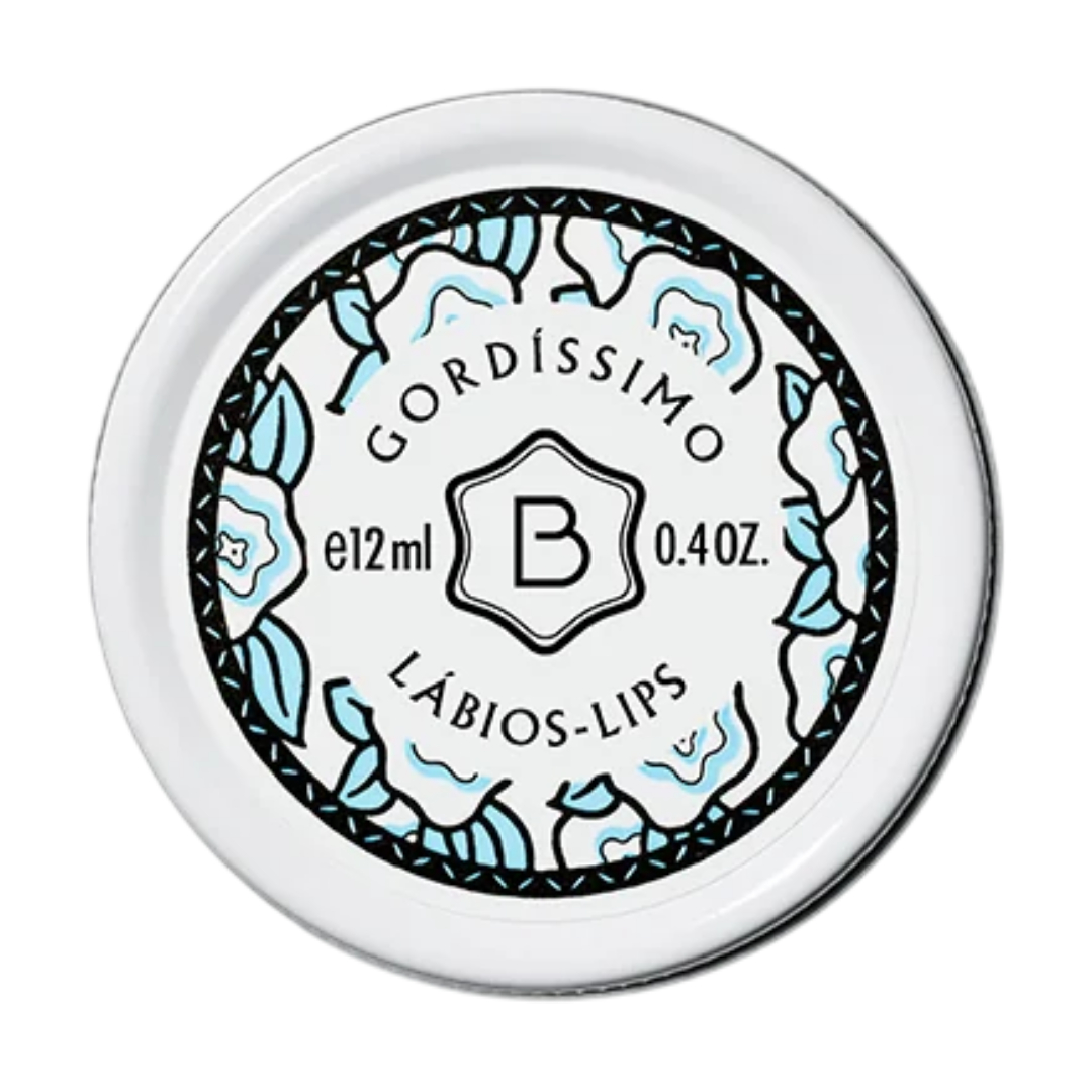 Benamôr - Bálsamo de Lábios Gordíssimo Embalagem redonda branca de produto para lábios com texto e decoração floral azul e preto