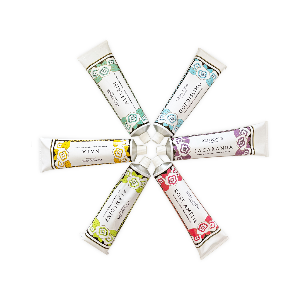 Benamôr - Creme Leite de Corpo Seis tubos de creme em círculo com etiquetas coloridas e nomes visíveis