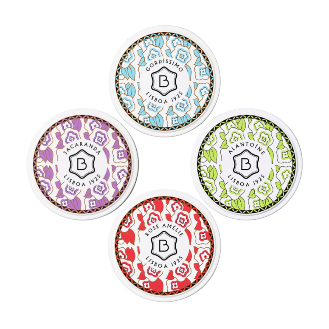 Benamôr - Manteiga Suprema Corporal Quatro latas redondas decorativas com padrões florais em azul, lilás, verde e vermelho e texto central em português.