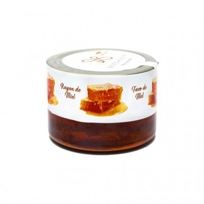 Frasco com favos de mel e etiqueta com textos Rayon de Miel e Fave de Mel